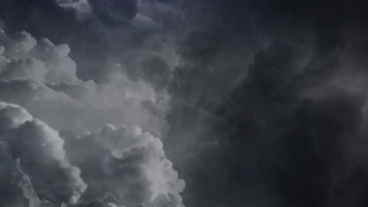 View of dark clouds in the sky and lightning flashes