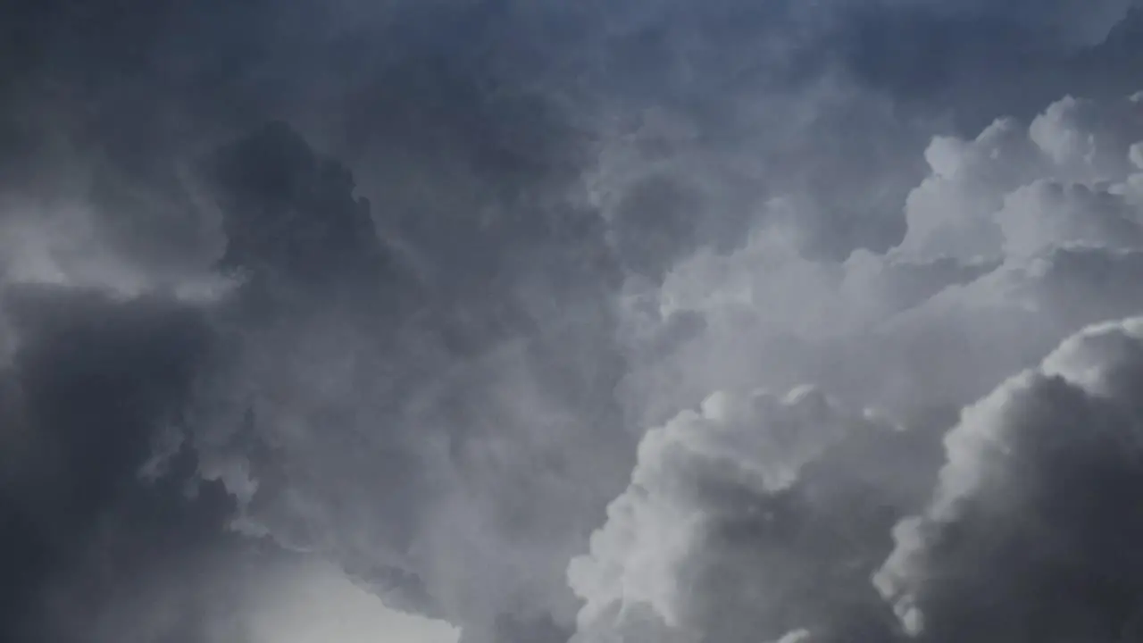 Lightning flashes in dark and moving cumulonimbus clouds