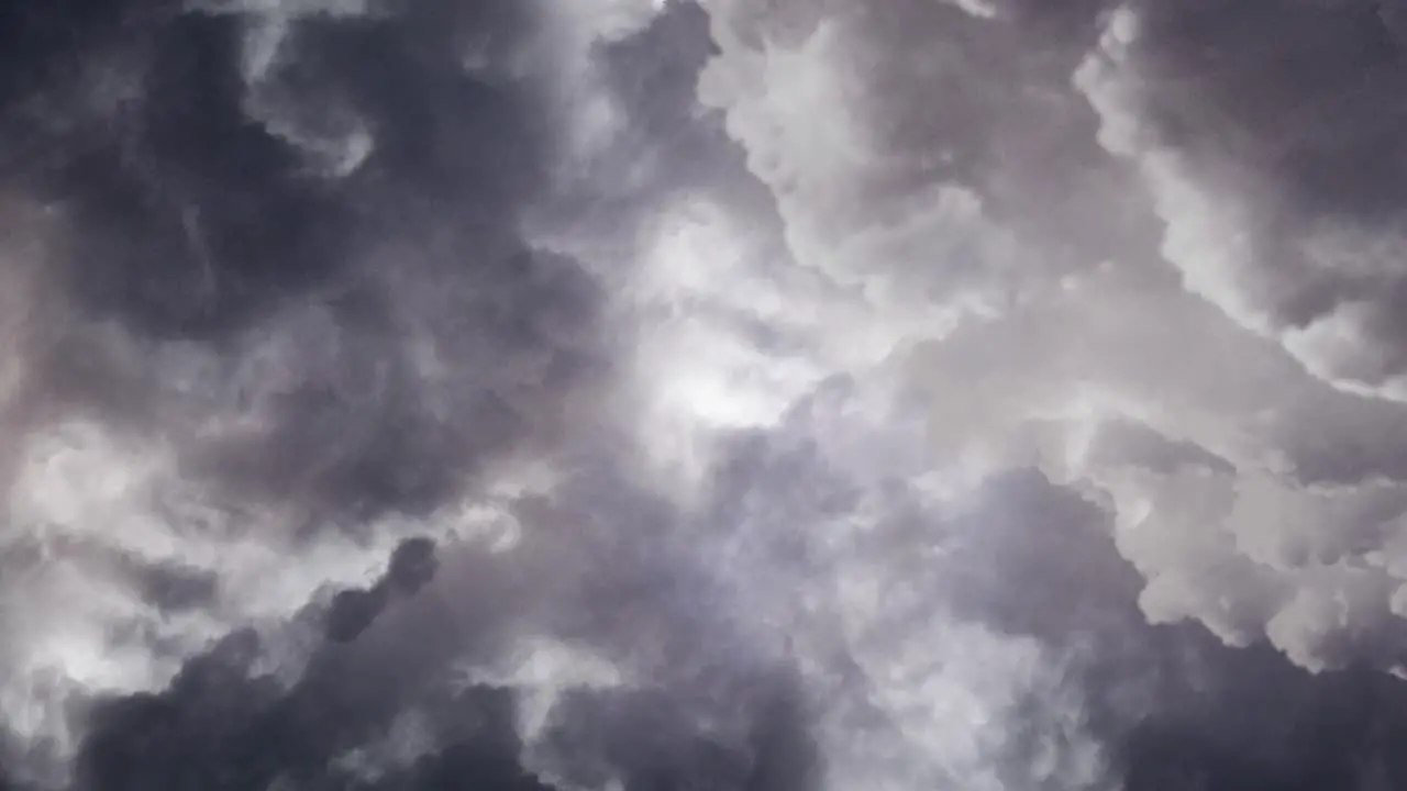 view of a cloud in a dark sky with burning lightning