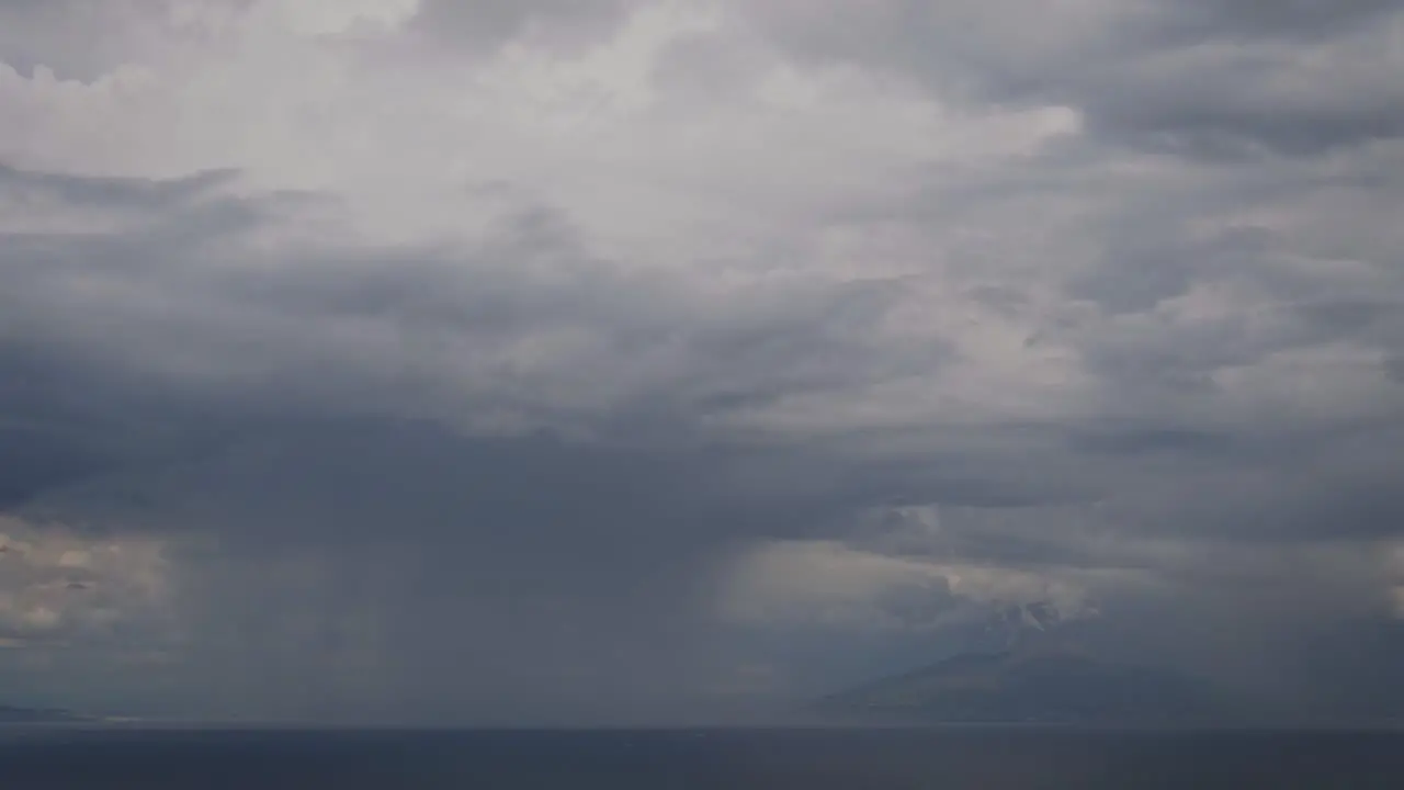 Aerial view of a rainy day and clouds on the sea near Vesuvius Naples and Capri Timelapse