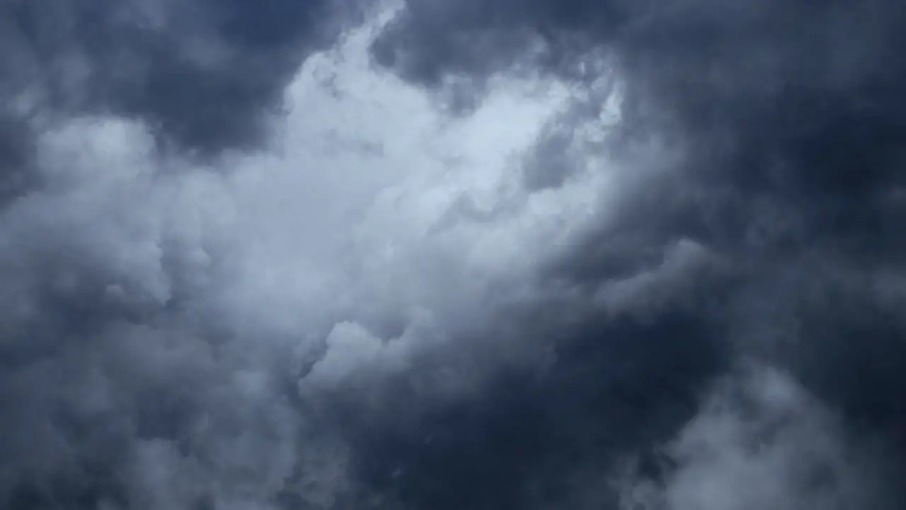 Cinematic Massive thunderstorm moves cumulus clouds