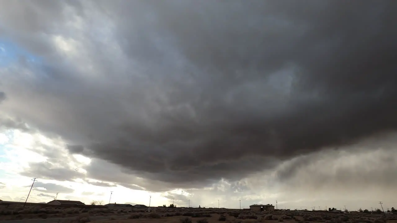 Dark Grey Storm Clouds Blow Across California Desert Time Lapse