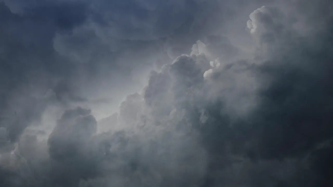 POV thunderstorm timelapse flying through dark cumulonimbus clouds in the sky 4K