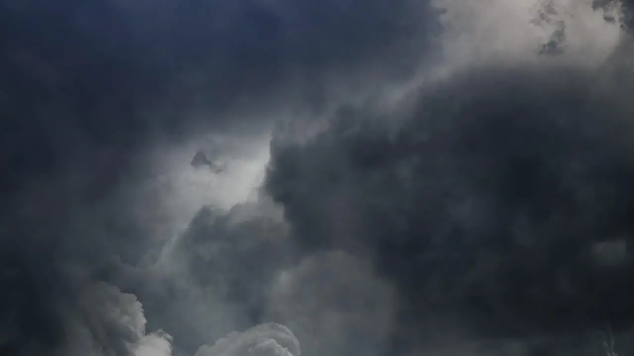 thunderstorm among cumulonimbus clouds in the sky