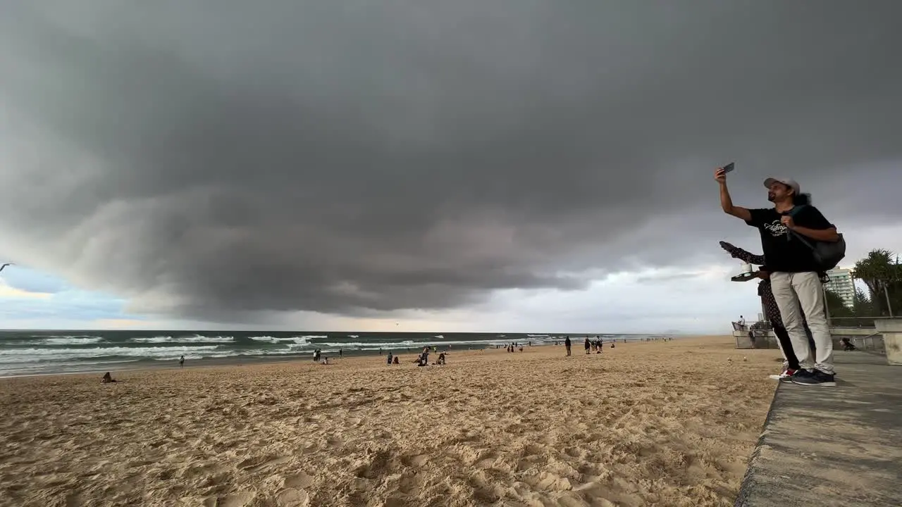 Dramatic movements of the stormy clouds covering the sky with ominous dark layer of clouds at the beach extreme weather wet and wild season forecasted Surfers Paradise Gold Coast Part 3