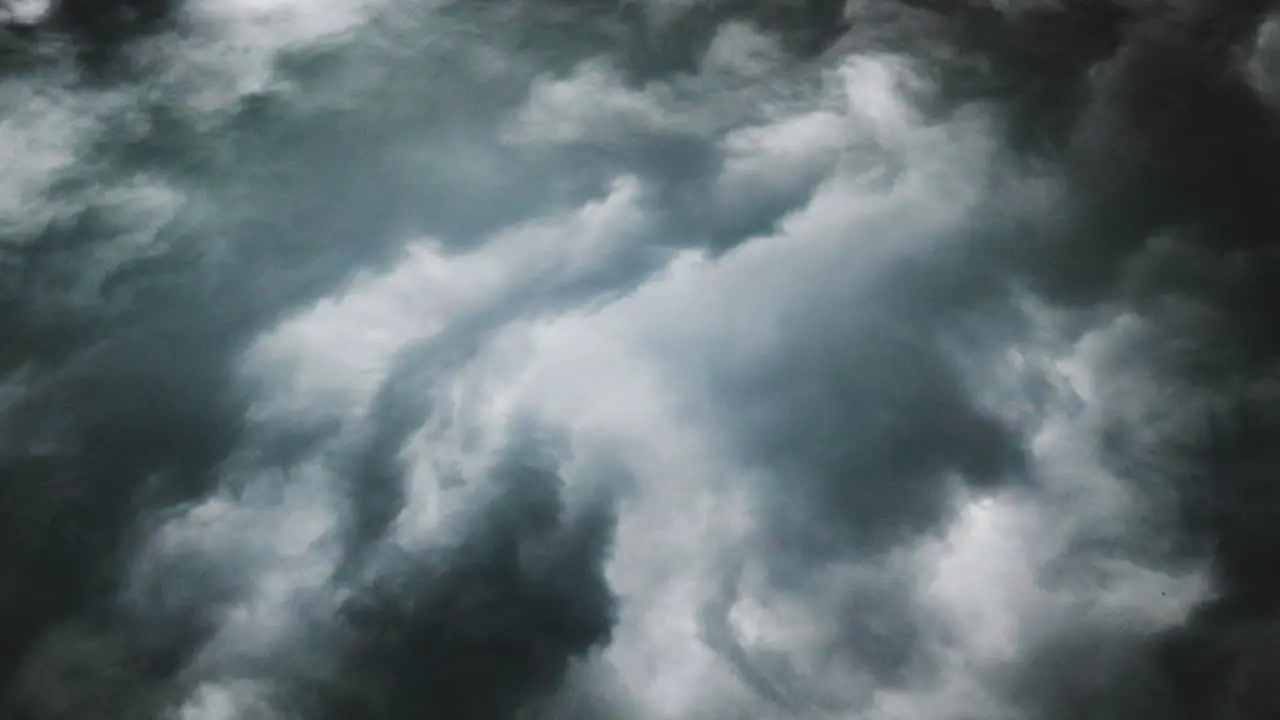 point of view a dark cumulus gray cloud with a thunderstorm in it moved across the sky