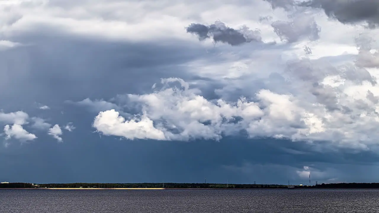 Time lapse shot of dark clouds emerge over sea climate change