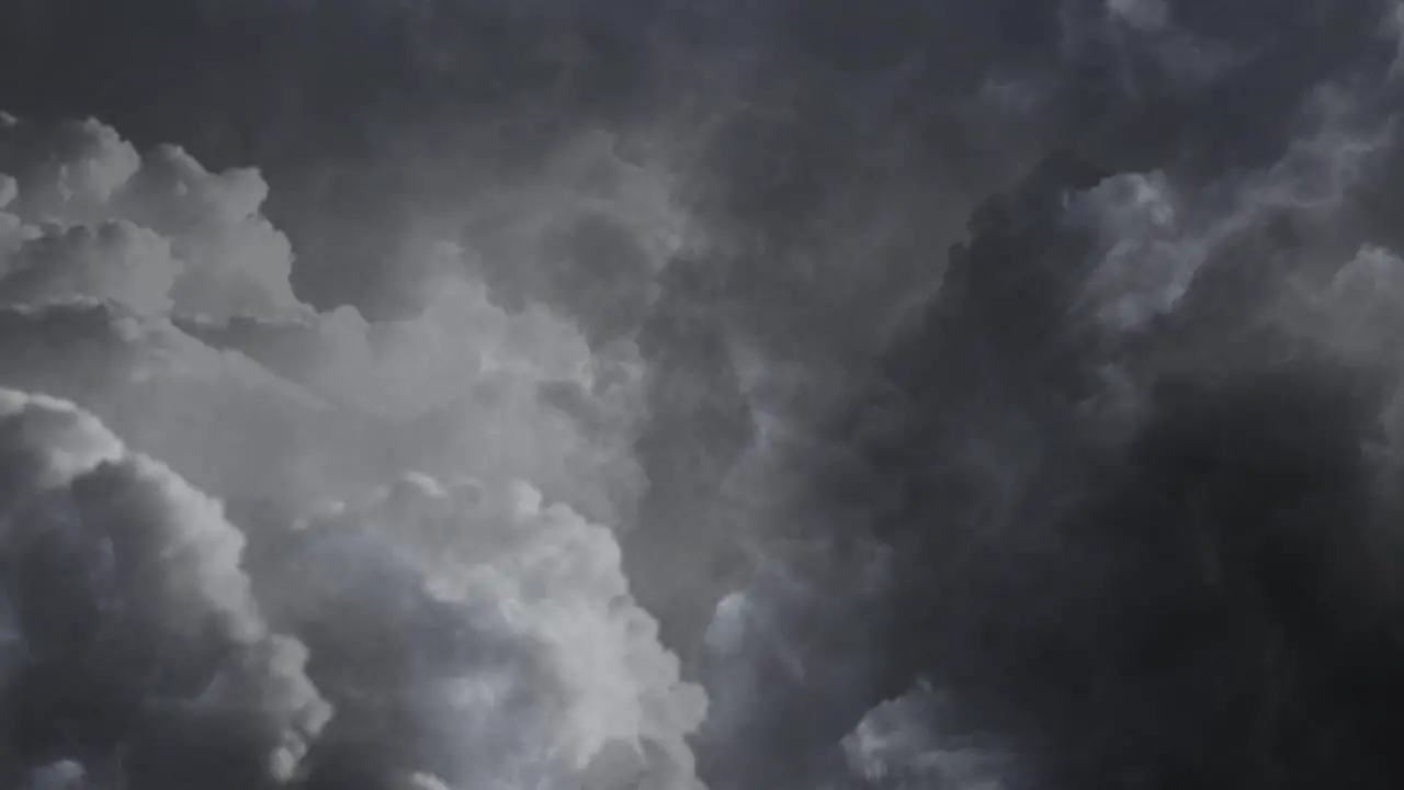 Dark and moving cumulonimbus clouds and thunderstorm