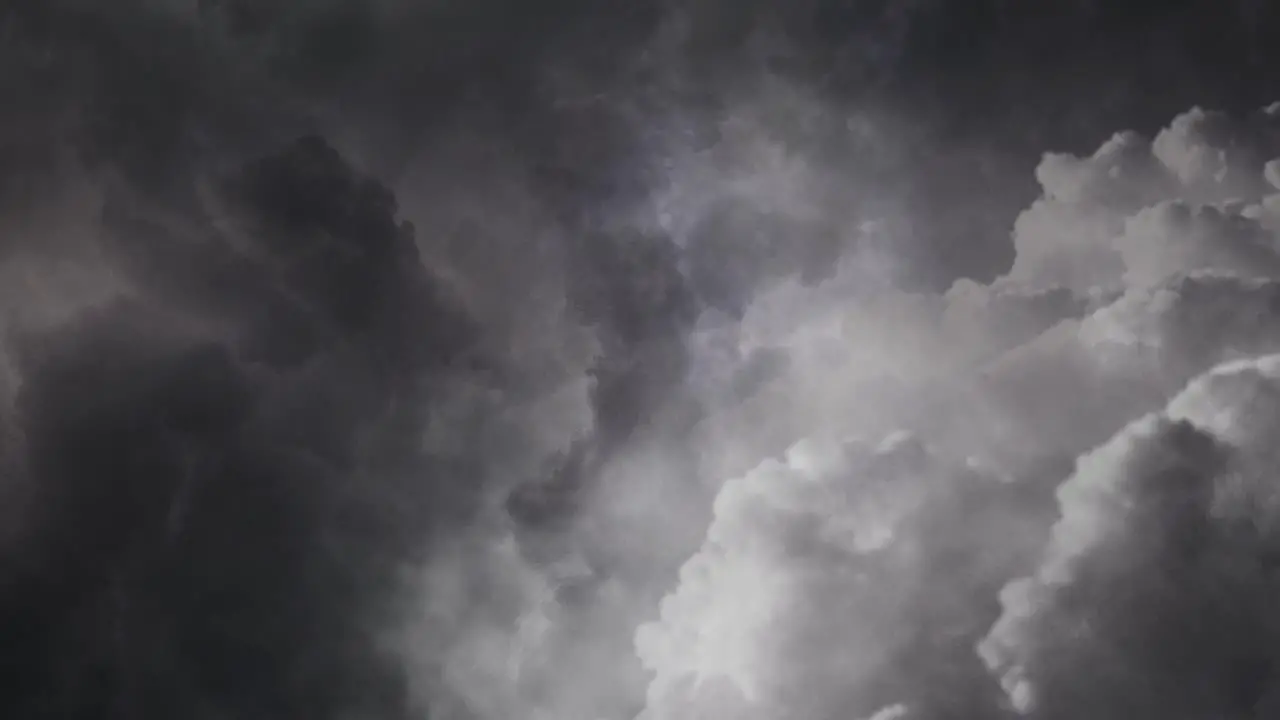 View of thick clouds in the sky with flashes of lightning