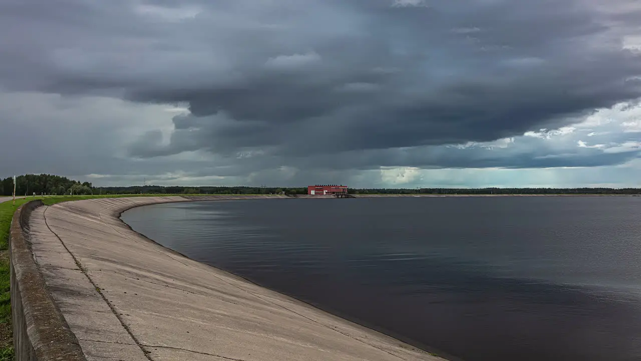 Storm Clouds Moving In The Sky Over Reservoir