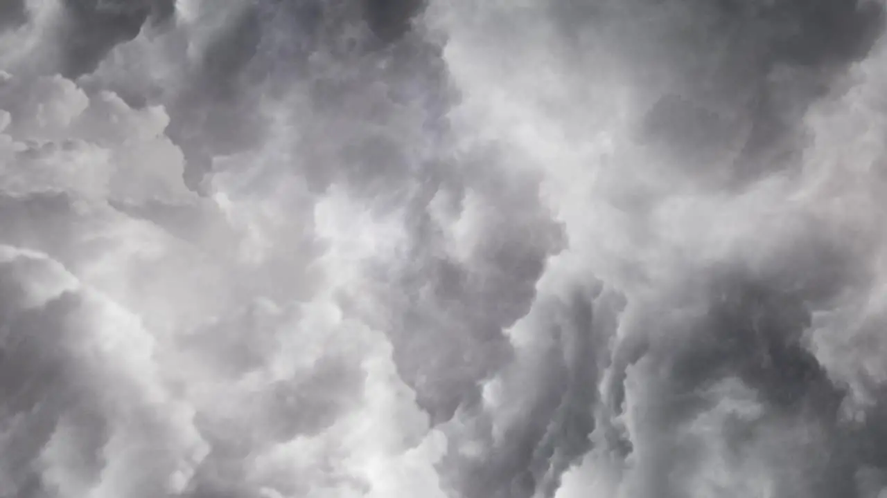 view of a thunderstorm in dark cumulonimbus clouds in the dark sky