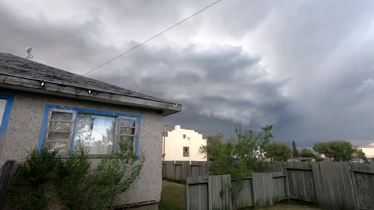 Huge storm in the sky over a small house in the country