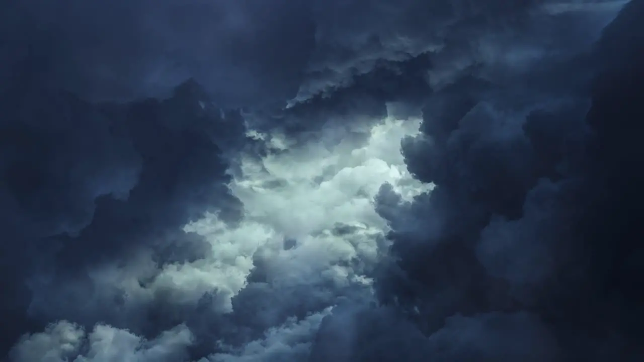 dark cumulonimbus clouds moving in the sky with thunderstorm