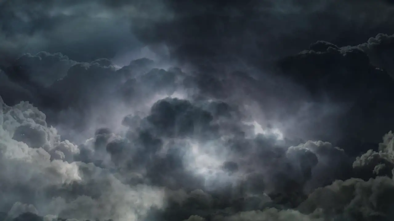 a thunderstorm with a bolt of lightning on the approaching dark clouds