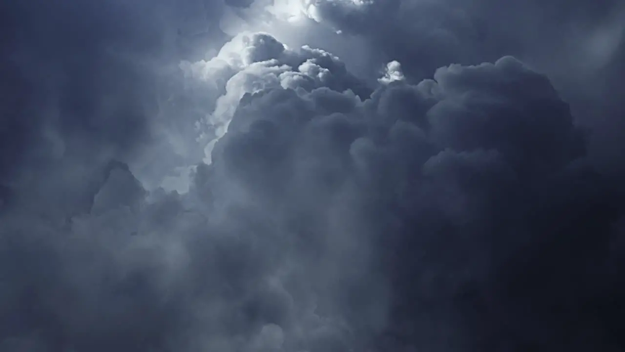 thunderstorm a ray of light inside a dark gray cloud in the sky that moves 4K