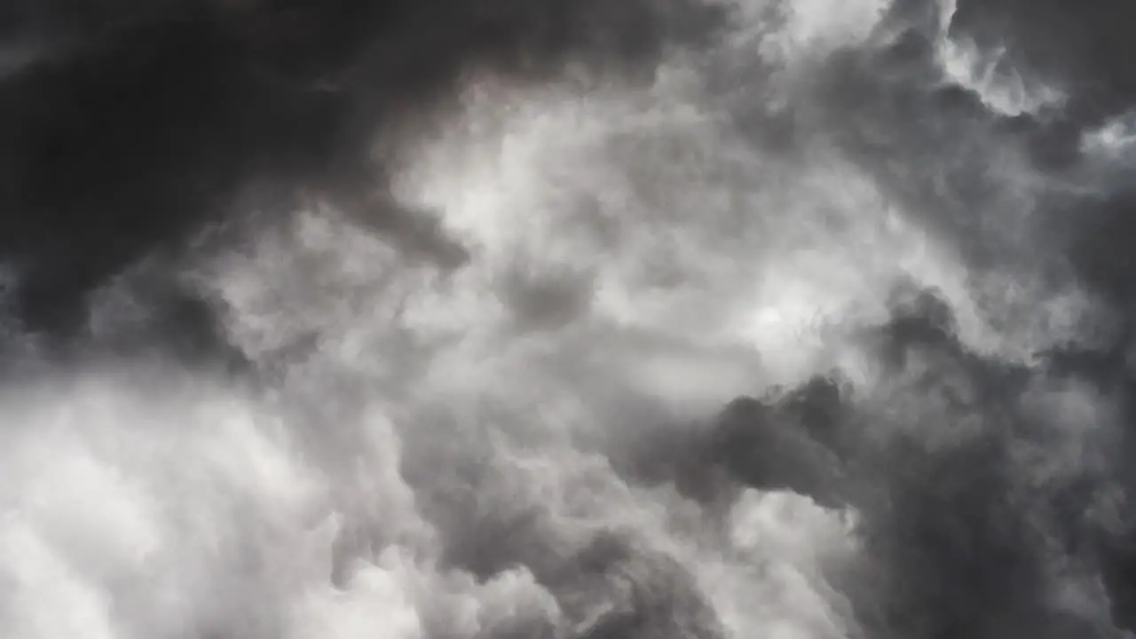 POV of gray clouds and thunderstorm above the sky