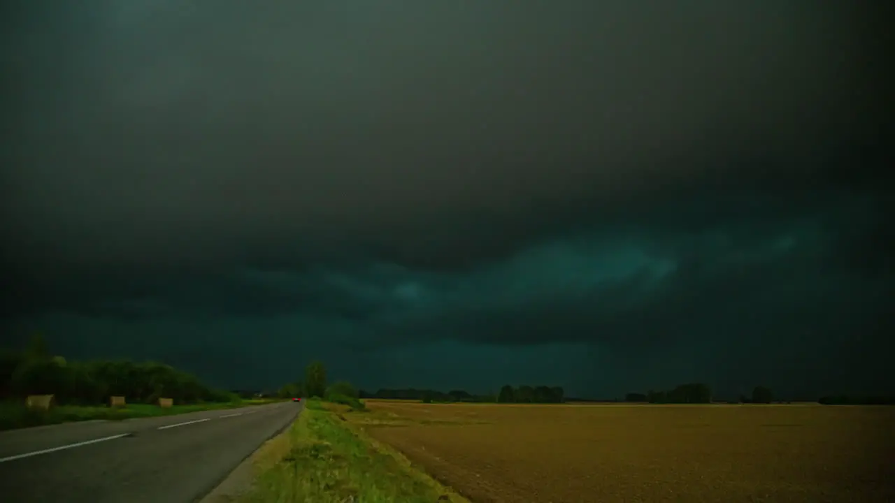 Dramatic dark storm clouds in timelapse over rye fields