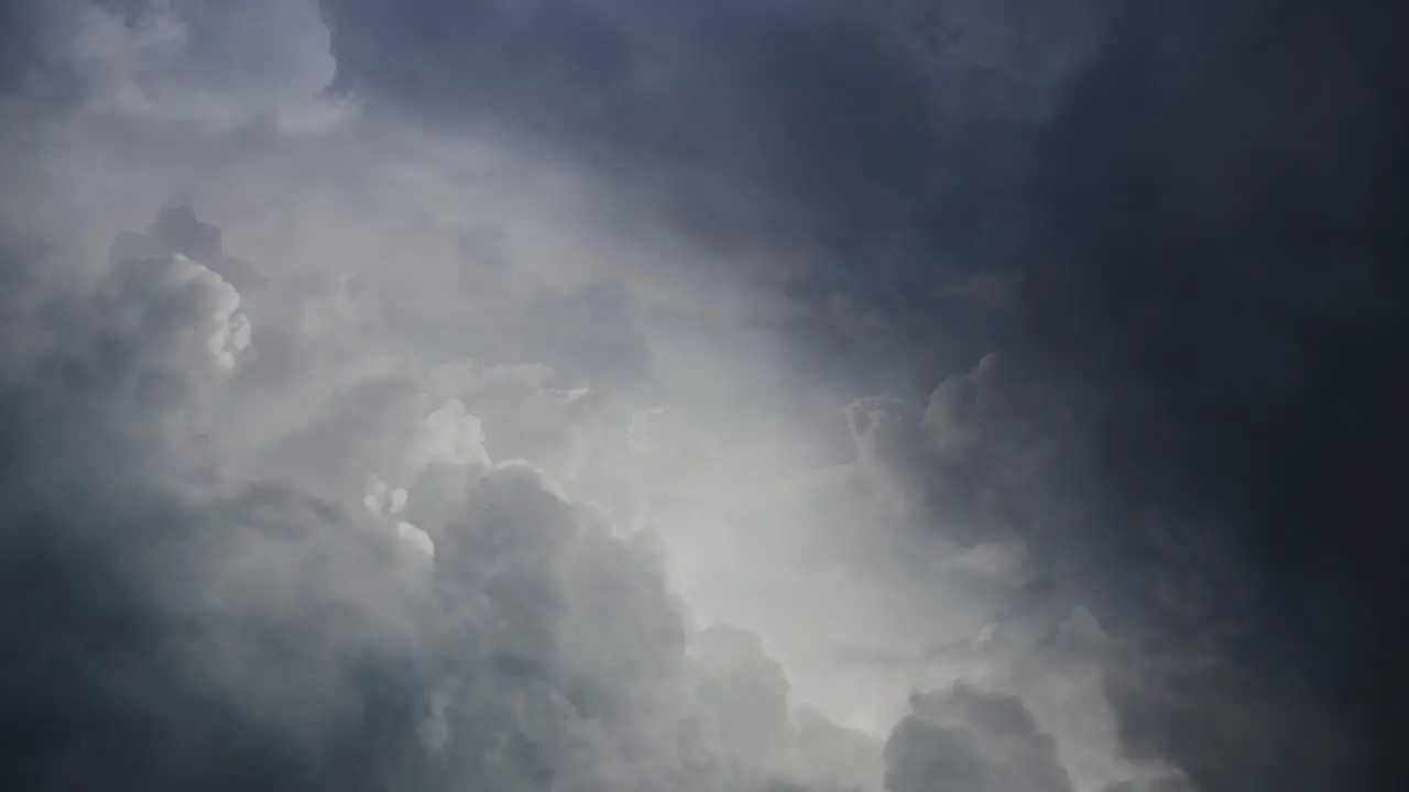 POV lightning flashes among moving clouds in the sky thunderstorm