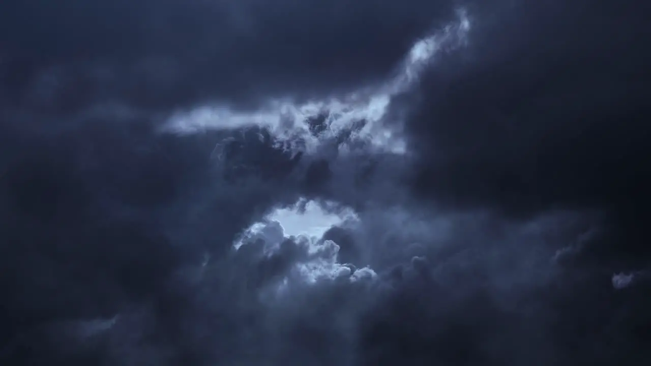 thunderstorm over dark sky and moving clouds