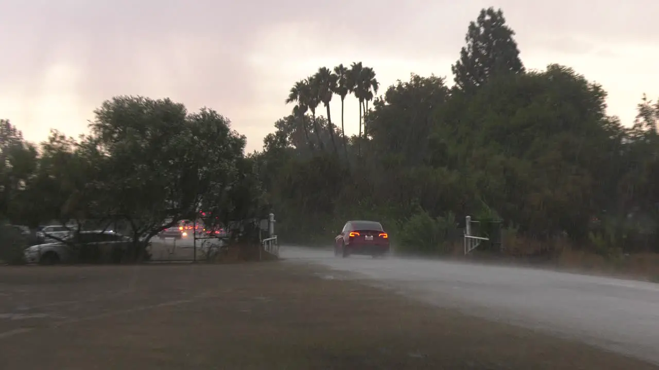 Car drives through flooded waters