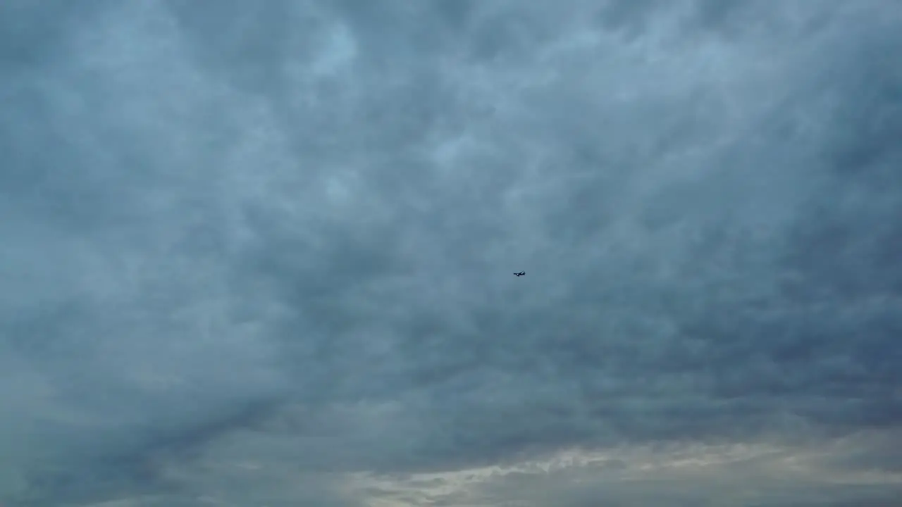 Airplane flies through stormy skies