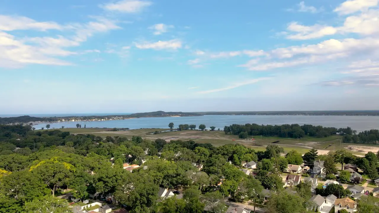 Aerial pan up over Muskegon Lake in the Lakeside neighborhood of Muskegon