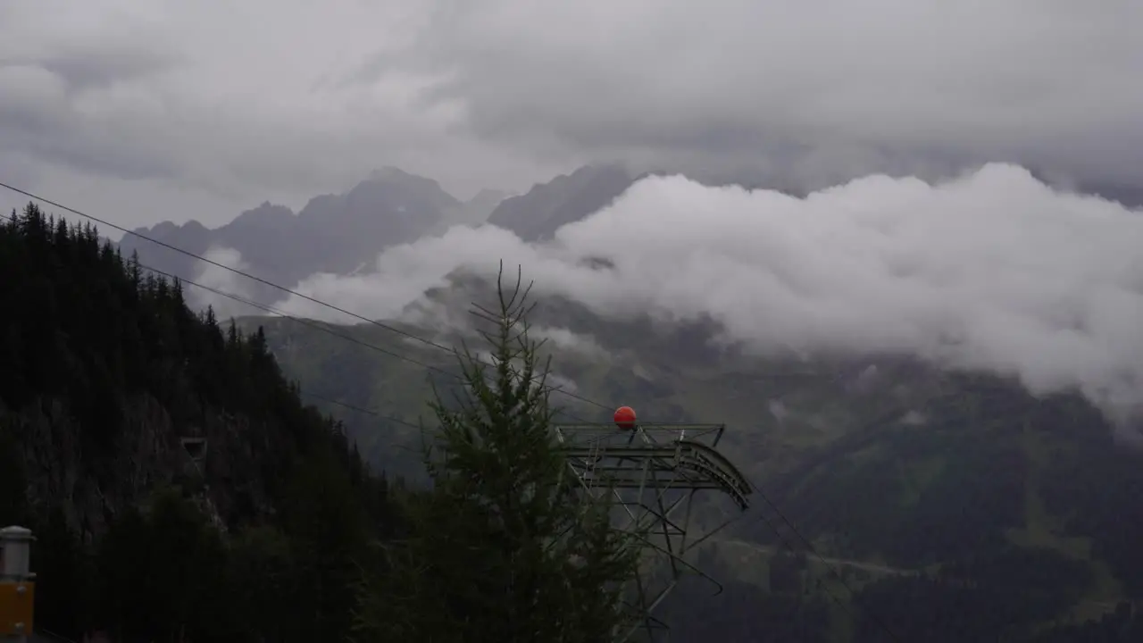 Zoomed in shot of clouds over Alps on a rainy day