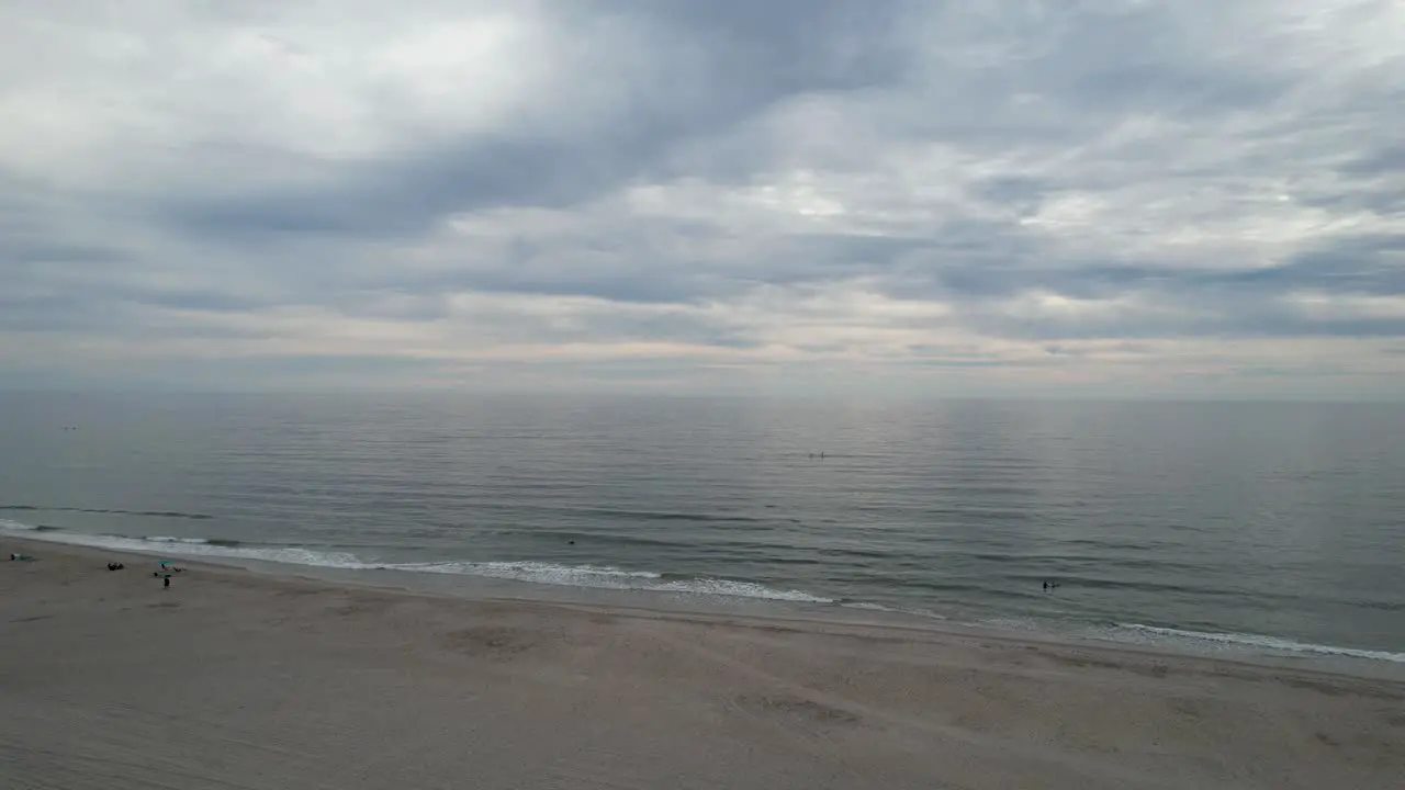 Rising shot over the beach on a cloudy morning