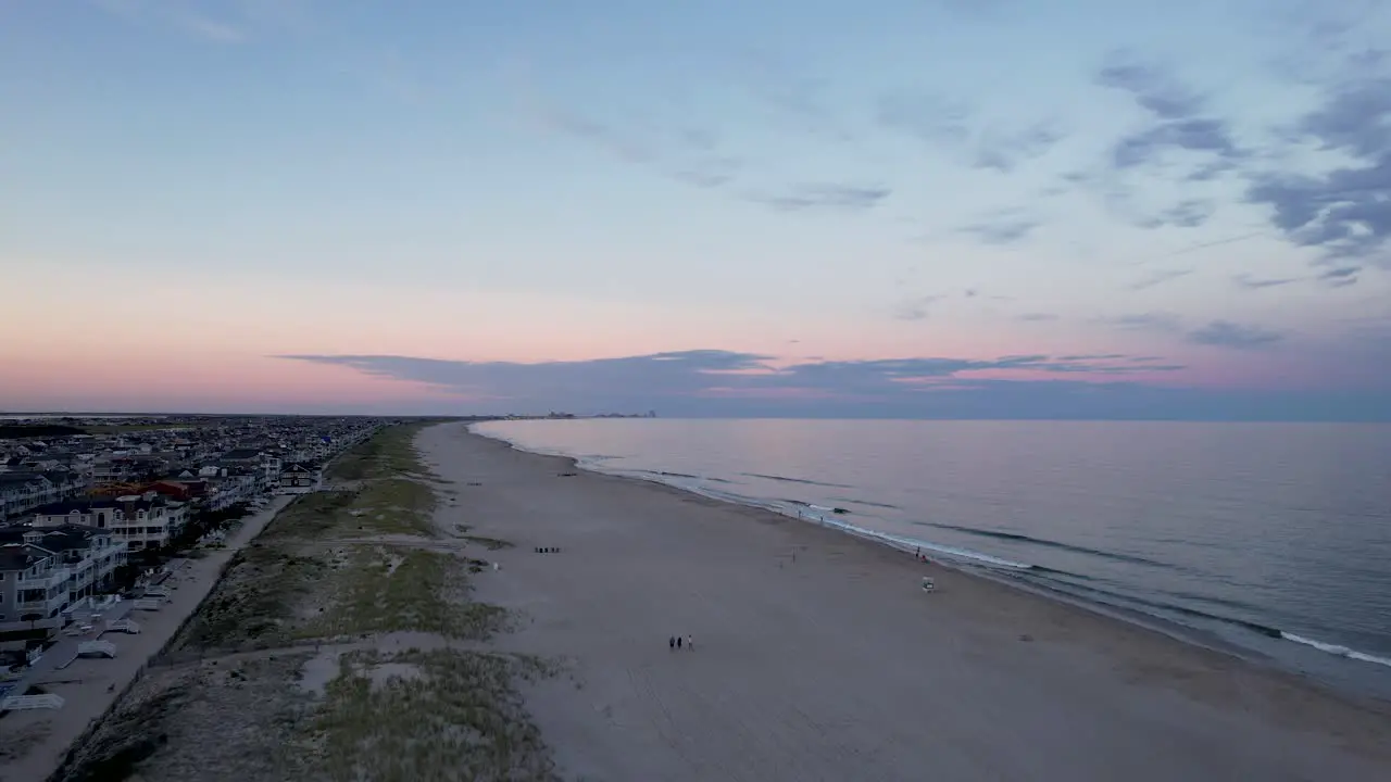 Aerial view from a drone flying over an Ocean City New Jersey beach at dusk