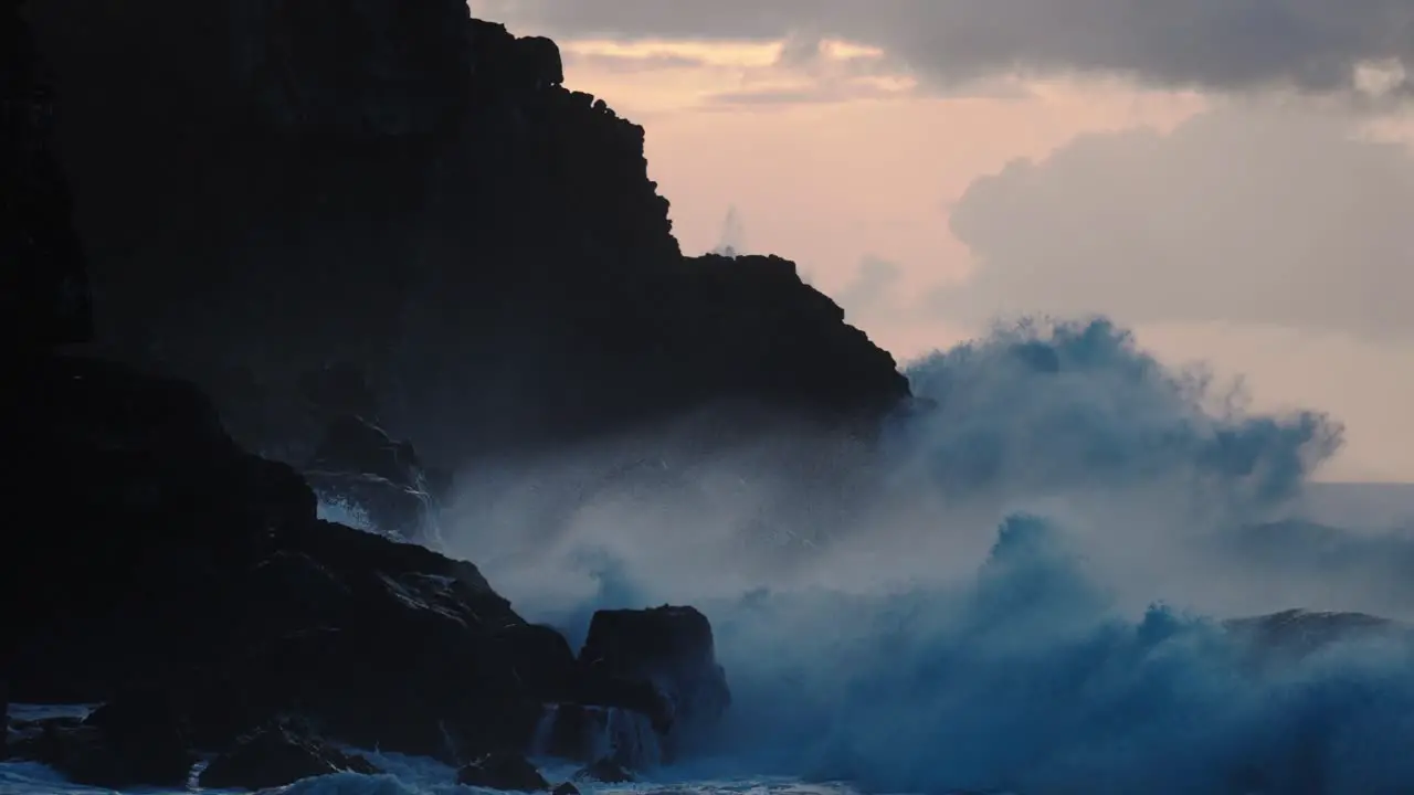 Extreme slow motion of beautiful ocean waves crashing into Kaiaka Rock Molokai Hawaii 3