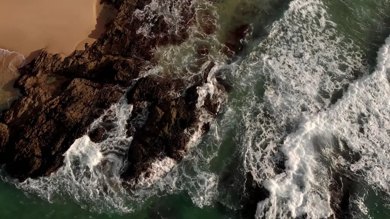 Waves breaking on rocky outcrop