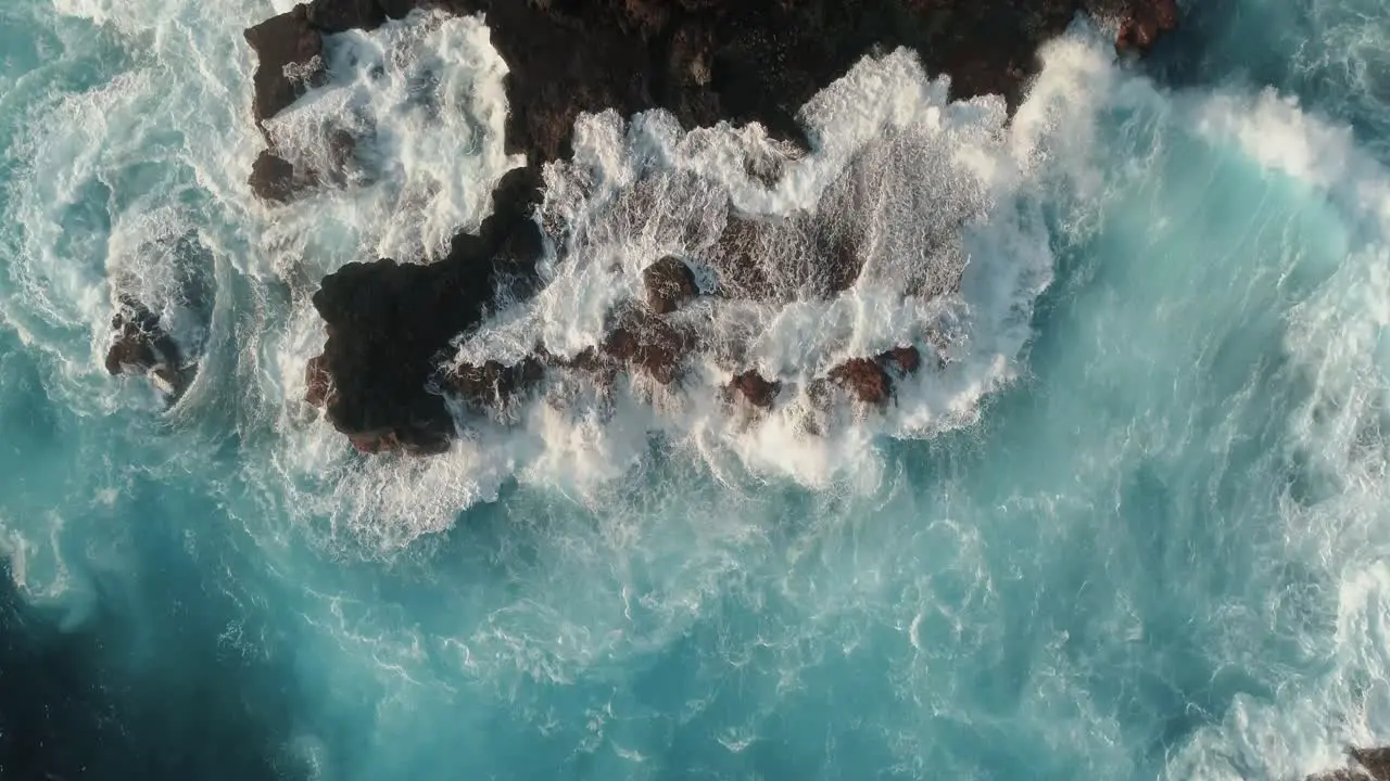 Top down views of ocean action on rocks