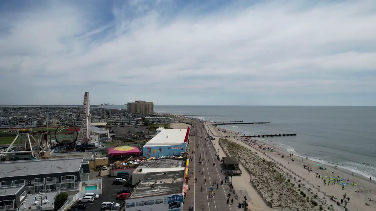 Aerial shot over the Ocean City New Jersey boardwalk on a warm sunny day