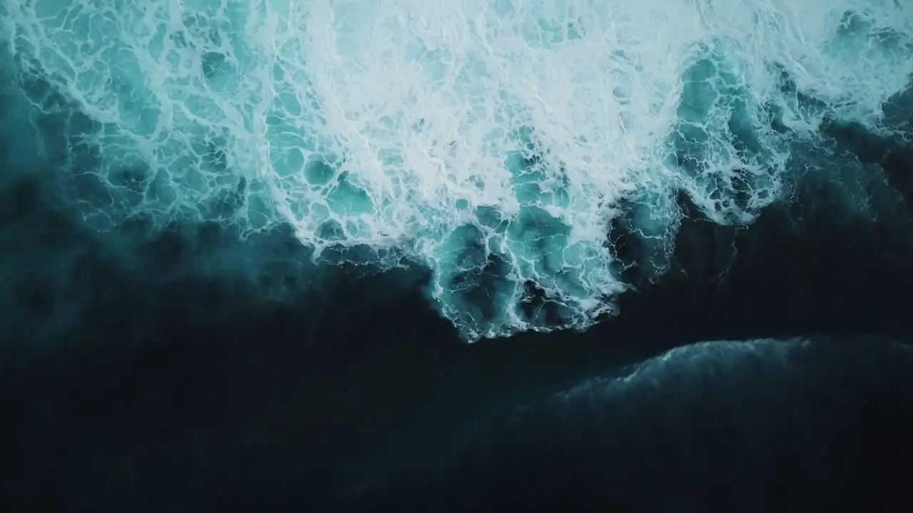 Aerial view of a big wave crashing onto the rough seas found on the North Shore of Oahu Hawaii