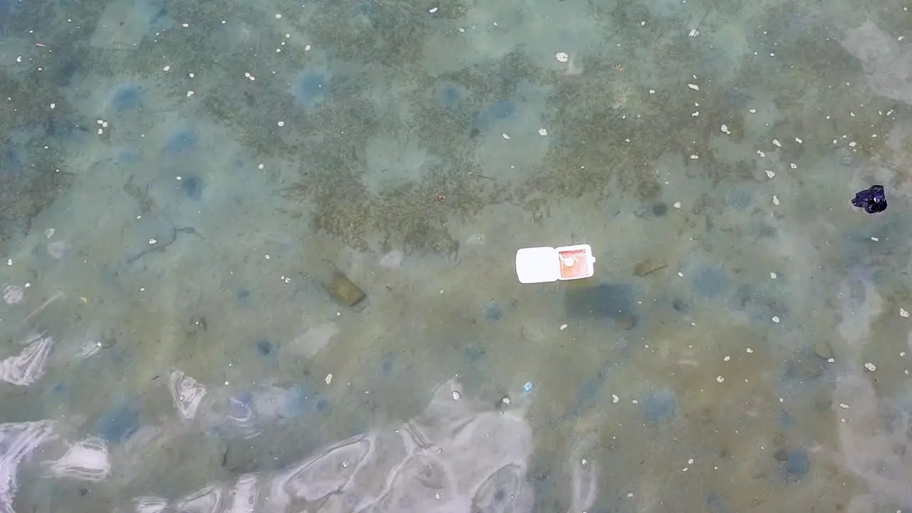 Plastic pollution in ocean caused by human rubbish and waste floating and polluting the ocean environment