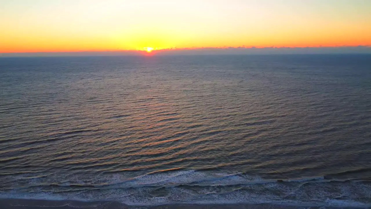 Early Morning Sunrise Over The Ocean And Shore