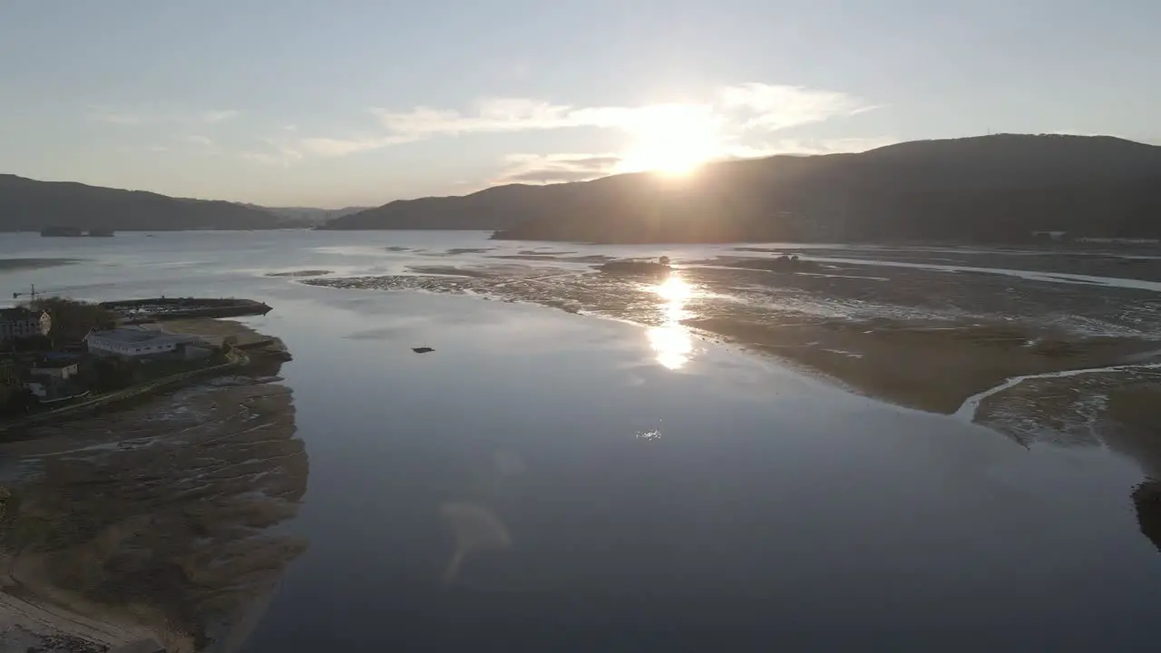 A moving shot of a ocean surrounded by hills