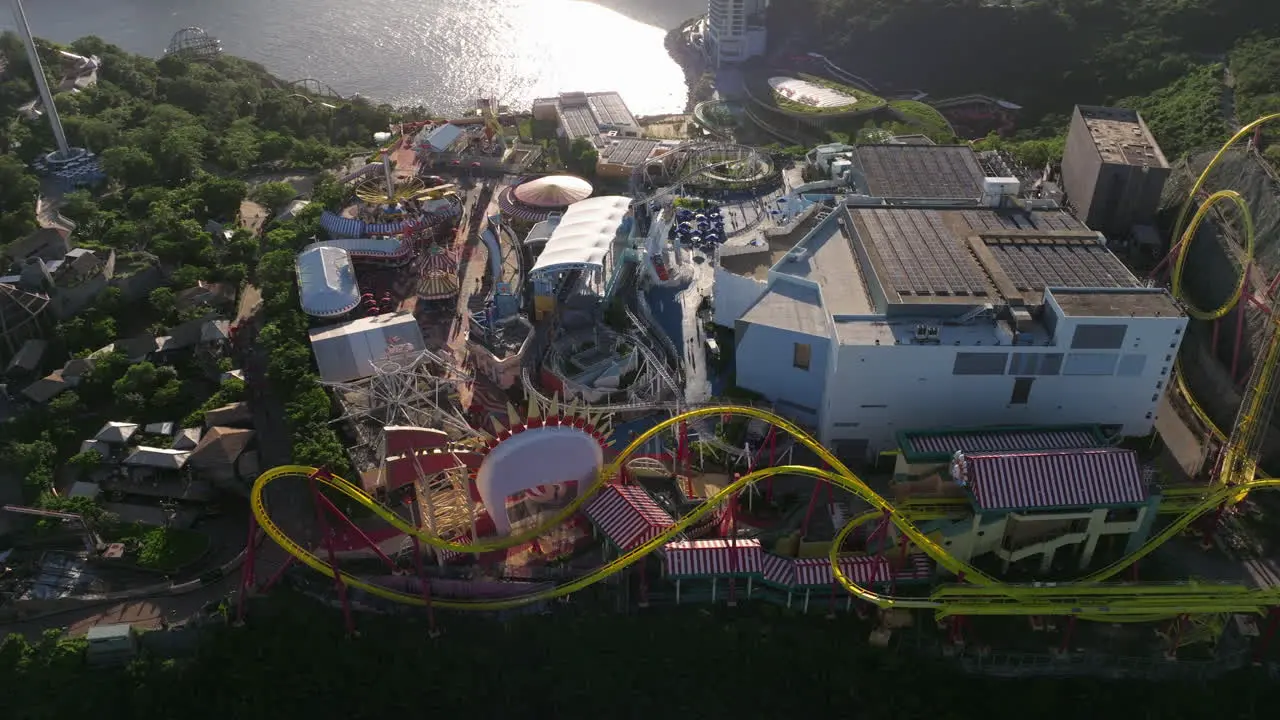 Orbiting shot of Hong Kong Ocean Park amusement park during golden hour