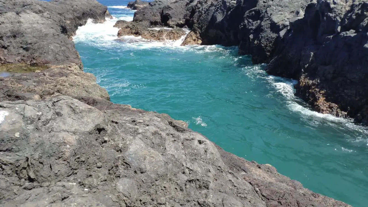 Volcanic rock formations from cooled lava by the sea shore in Canary Islands archipielago