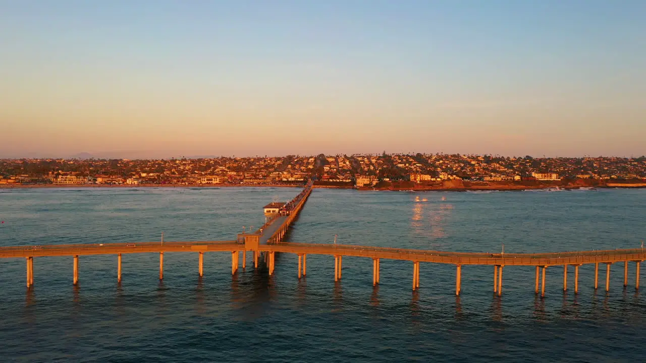 Sunset over Ocean Beach Pier San Diego California drone sideways