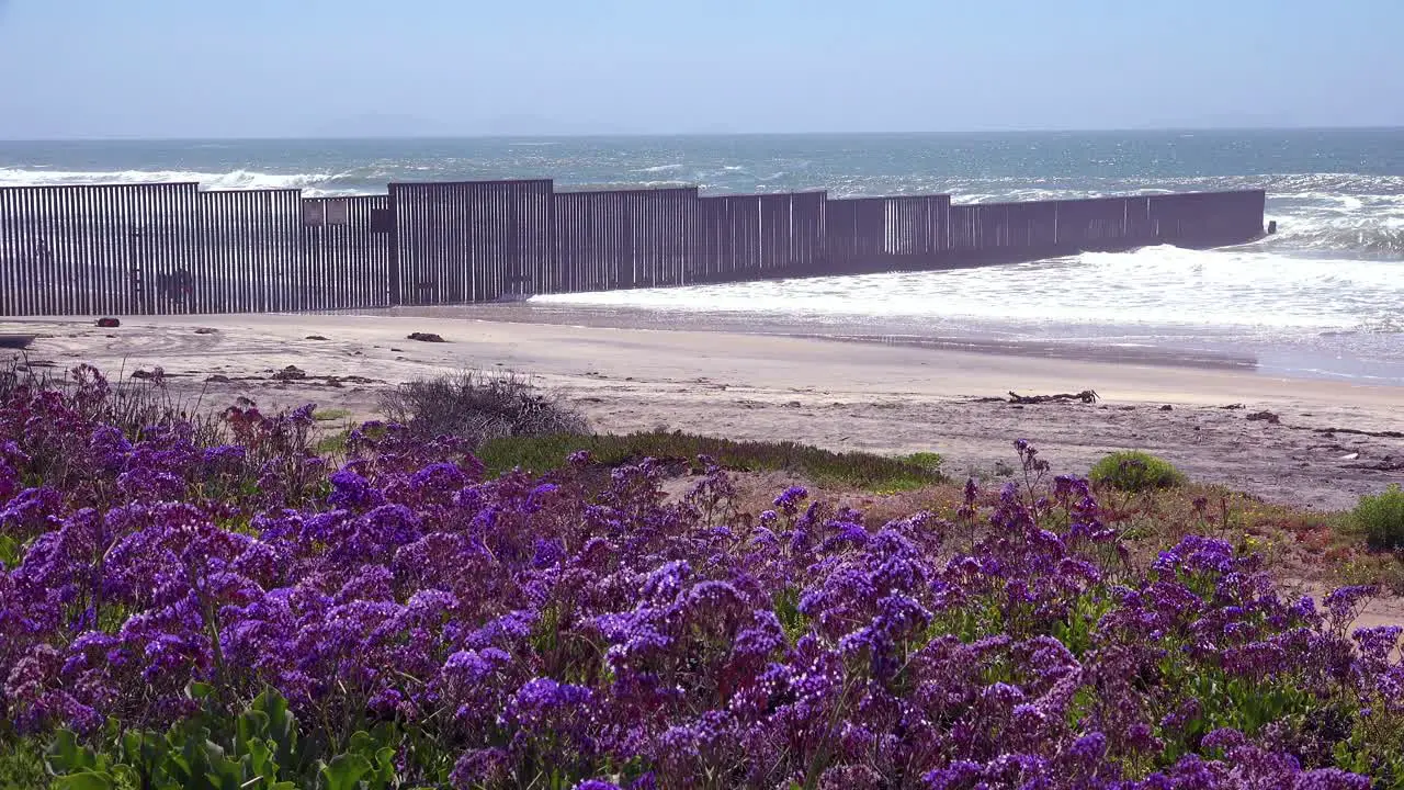 Waves roll into the beach at the US Mexico border fence in the Pacific Ocean between San Diego and Tijuana 2