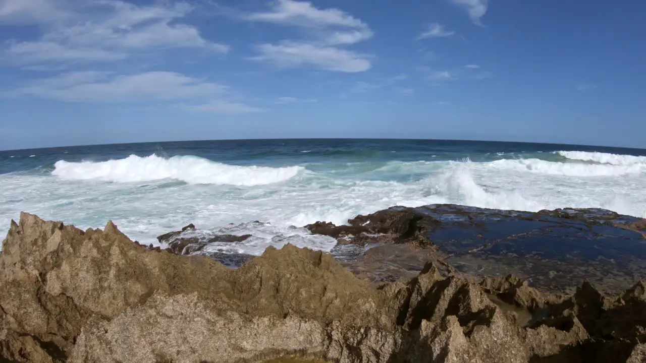 Crushing waves under a blue sky along the African coast