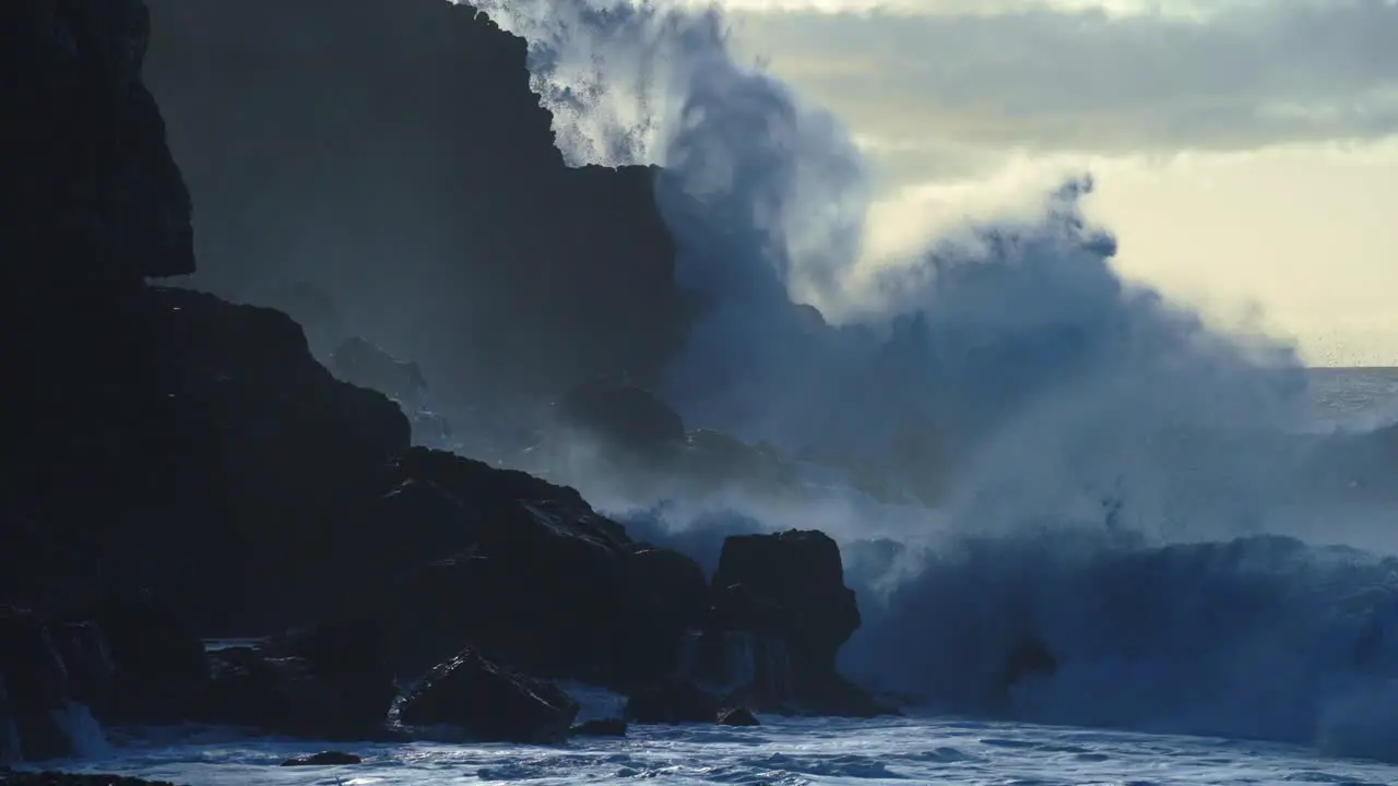 Extreme slow motion of beautiful ocean waves crashing into Kaiaka Rock Molokai Hawaii 9