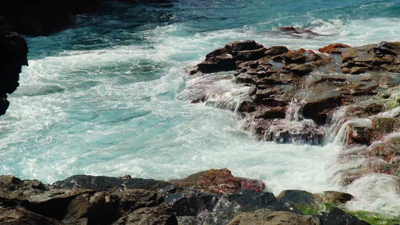 Extreme Waves Breaking Against Rocky Coast Of Beach At Summer In Tenerife Spain