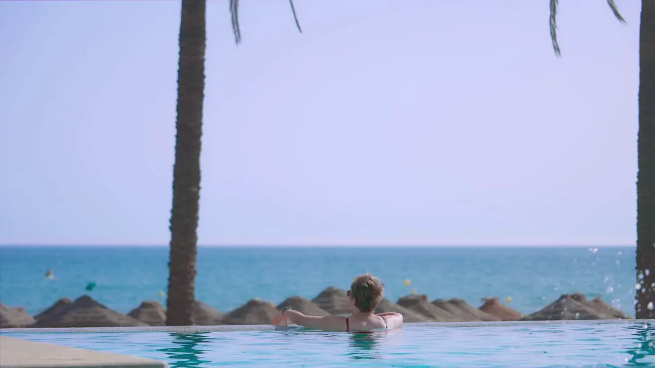 Woman enjoying the view from the Infinity Pool