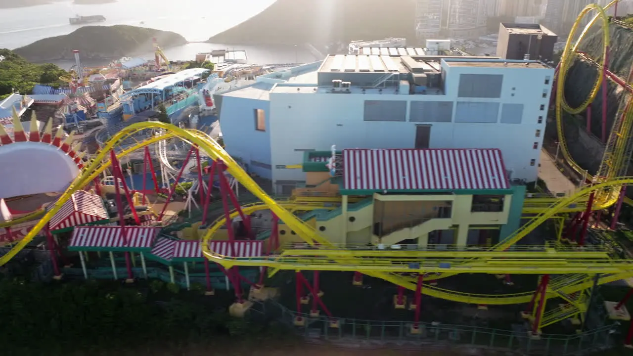 Aerial sideways shot of Hair Raiser rollercoaster in Ocean Park Hong Kong during sunset light