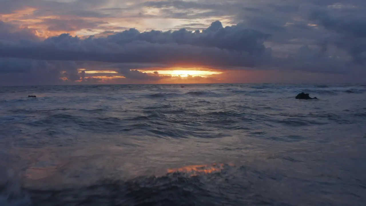 Close up view of blue sea waves in twilight Rough ocean waves in stunning golden sunset light