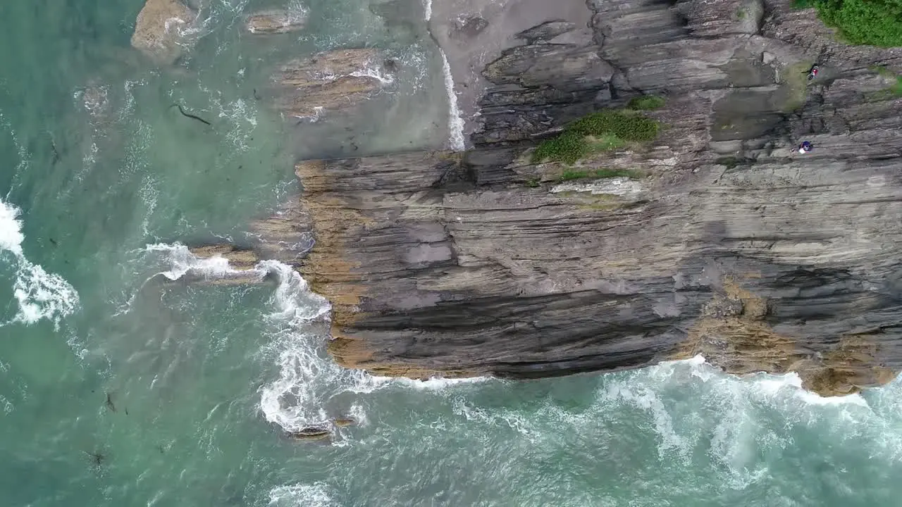 Flying down on ocean rock formation