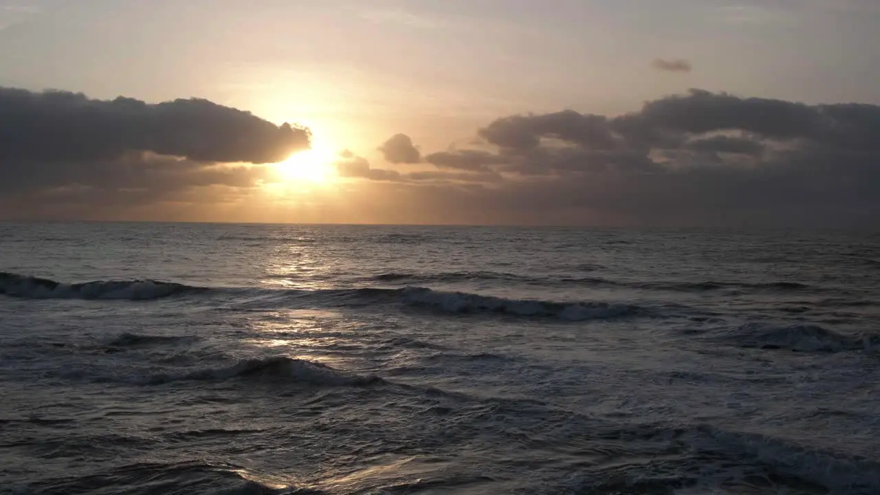 Watch as the sun sets over the ocean in this breathtaking video