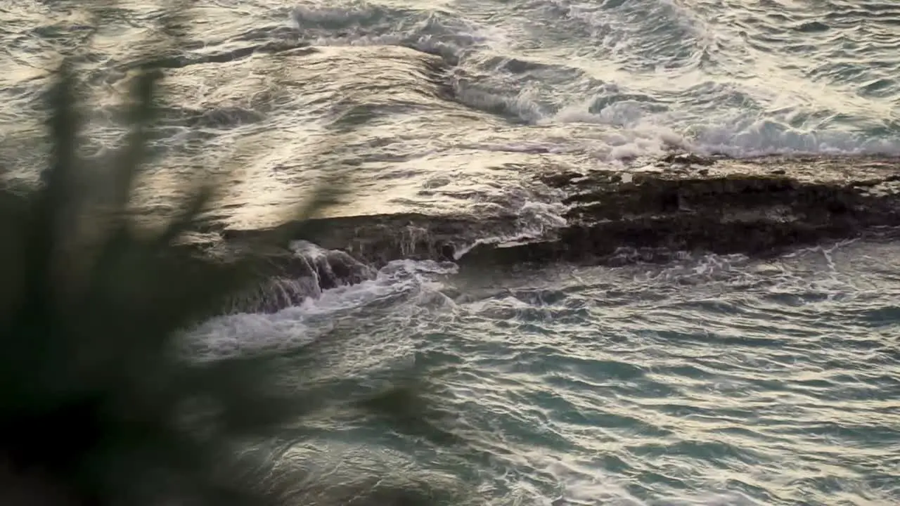 Slowmotion clip rocky coast with waves splashing against the rocks in the atlantic ocean